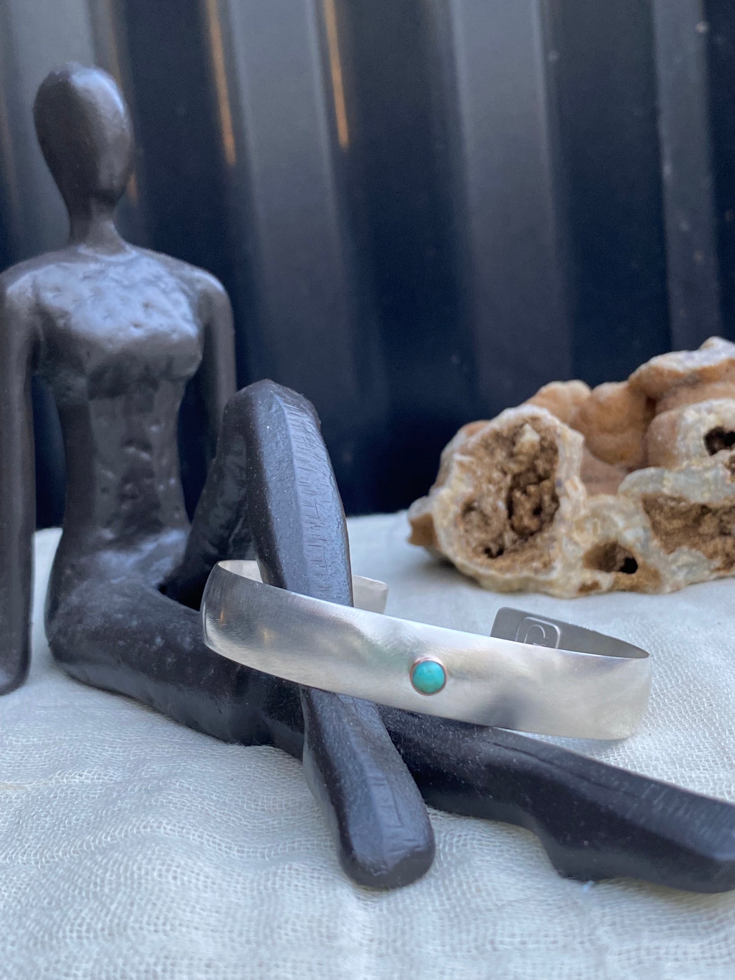 Wide Sterling Silver bracelet with a hint of Turquoise